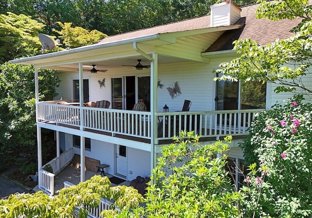 back of house with ceiling fan