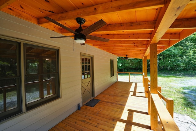 wooden deck featuring ceiling fan