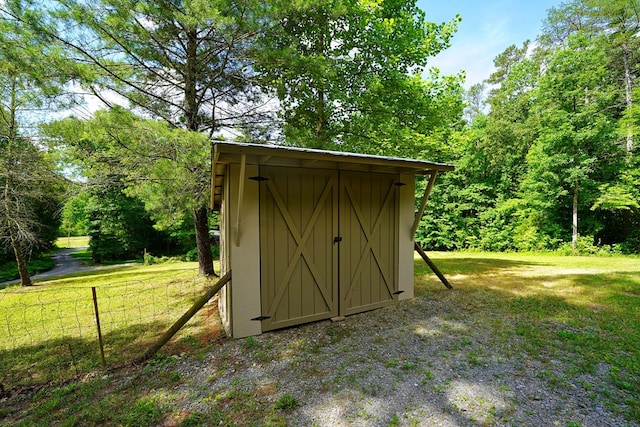 view of outbuilding with a lawn