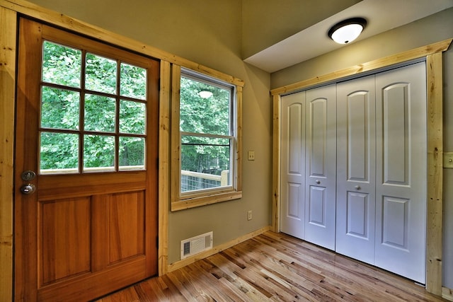 doorway to outside featuring light wood-type flooring