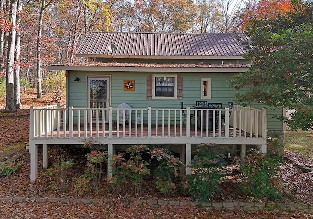 back of property with a wooden deck