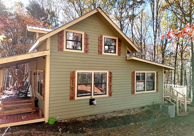 view of side of property featuring central AC