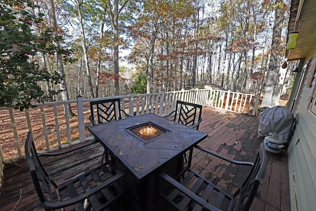 wooden terrace featuring grilling area