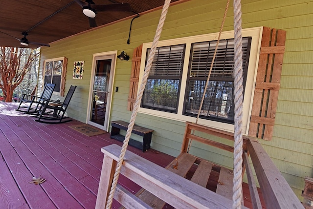 wooden terrace with covered porch and ceiling fan