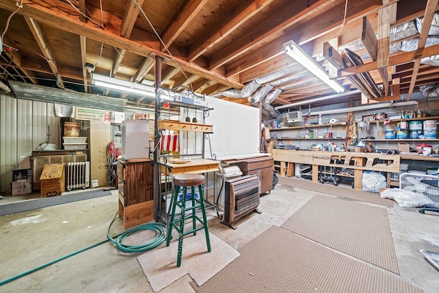 unfinished basement with a workshop area