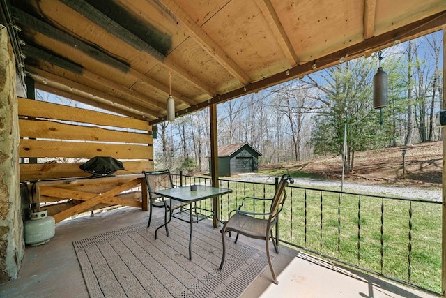 exterior space with an outdoor structure and outdoor dining space