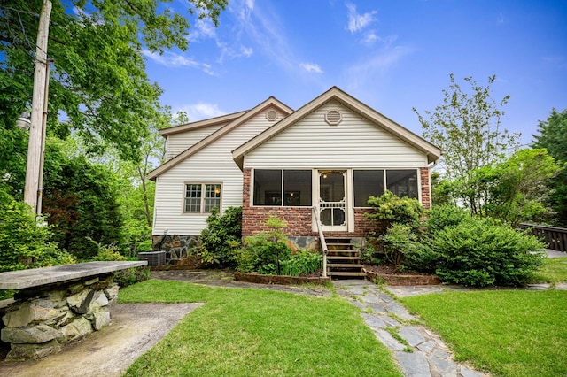 16 Hollow Springs Rd, Blue Ridge, GA 30513 - rear view of property with a sunroom, a yard, and brick siding