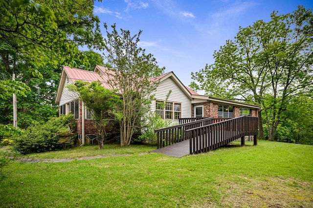 16 Hollow Springs Rd, Blue Ridge, GA 30513 - rear view of house featuring brick siding, a yard, and a wooden deck