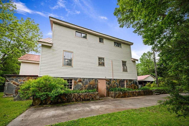 16 Hollow Springs Rd, Blue Ridge, GA 30513 - rear view of property with stone siding, metal roof, and a yard