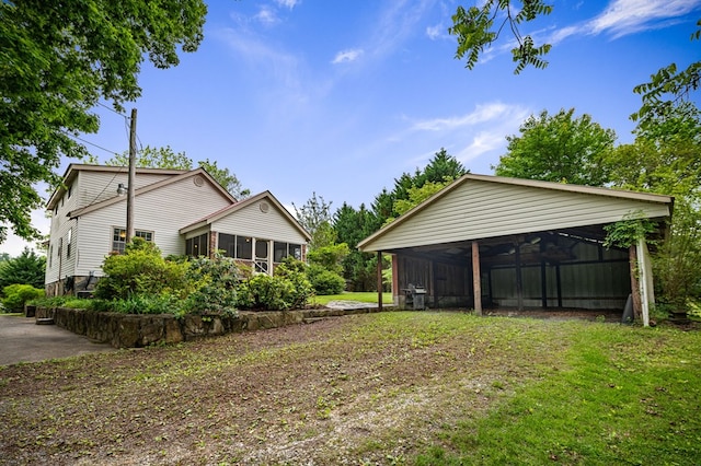 16 Hollow Springs Rd, Blue Ridge, GA 30513 - view of grassy yard with a sunroom, a carport, and an outbuilding