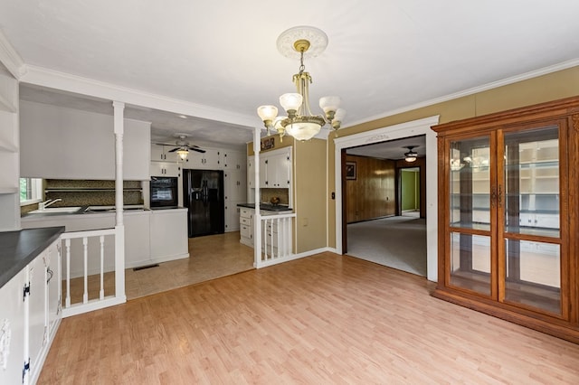 16 Hollow Springs Rd, Blue Ridge, GA 30513 - kitchen featuring ceiling fan, black appliances, tasteful backsplash, a chandelier, and crown molding