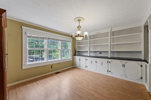 16 Hollow Springs Rd, Blue Ridge, GA 30513 - spare room featuring ornamental molding, a chandelier, light wood-style flooring, and baseboards
