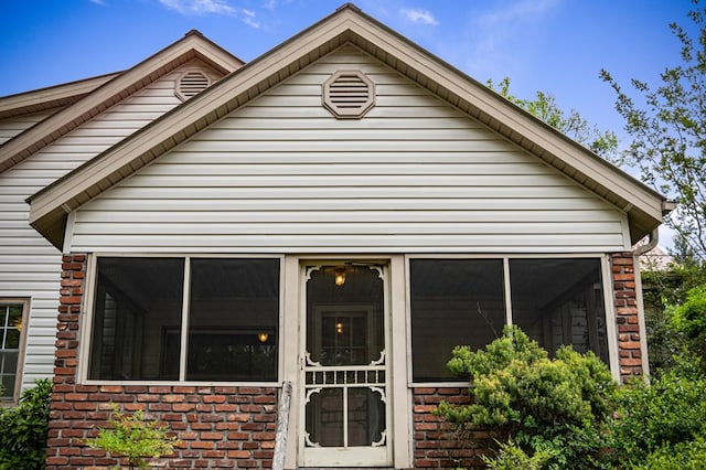 16 Hollow Springs Rd, Blue Ridge, GA 30513 - view of front of home with brick siding and a sunroom
