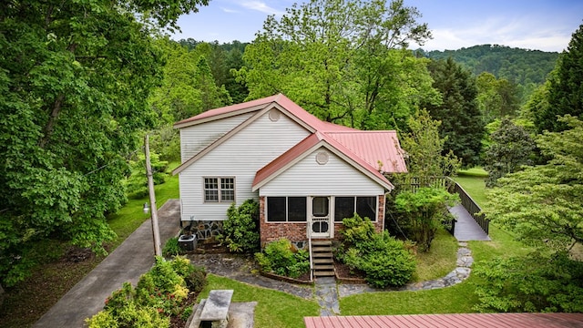 16 Hollow Springs Rd, Blue Ridge, GA 30513 - rear view of property with a view of trees, a sunroom, brick siding, and stairs