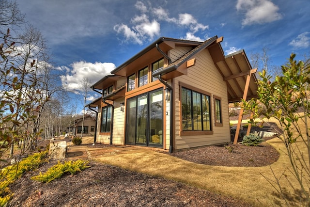 view of side of property featuring a patio