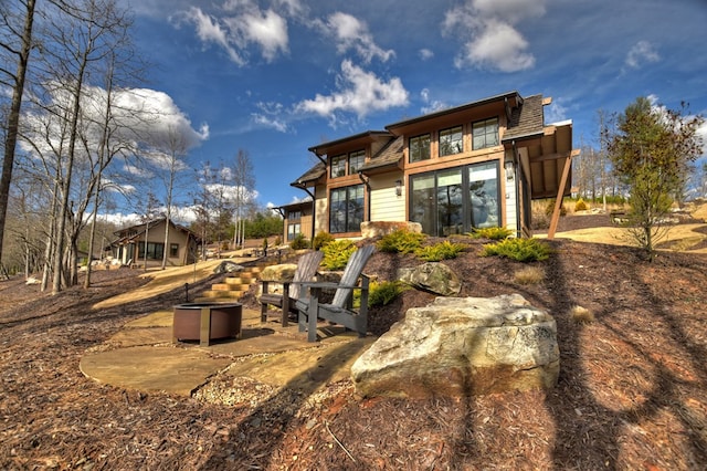 back of property featuring a patio area