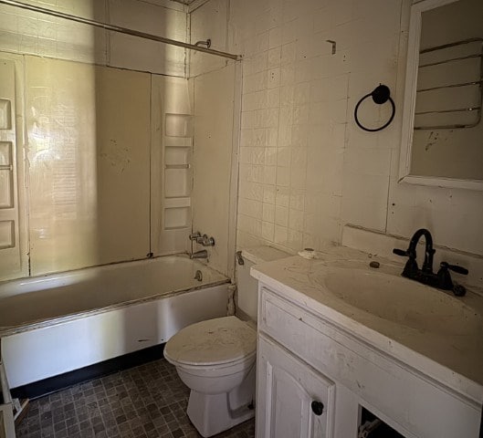 308 Beedie Jones Rd, Chatsworth, GA 30705 - full bathroom with toilet, vanity, shower / bathtub combination, and tile walls