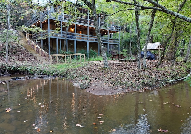 back of house with a water view