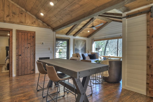 dining room with dark wood-type flooring, ceiling fan, lofted ceiling with beams, and wooden ceiling