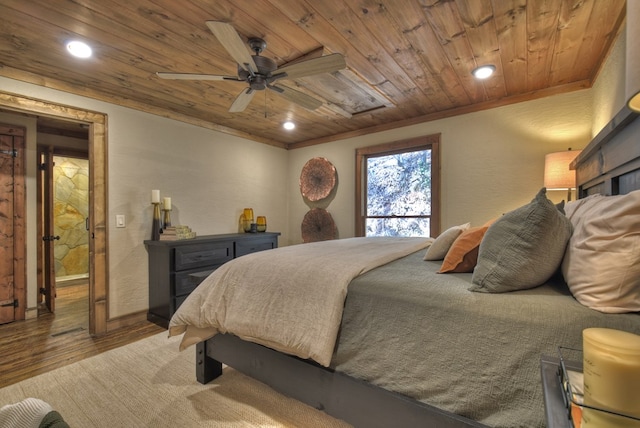 bedroom with wood ceiling, ceiling fan, ornamental molding, and light hardwood / wood-style flooring