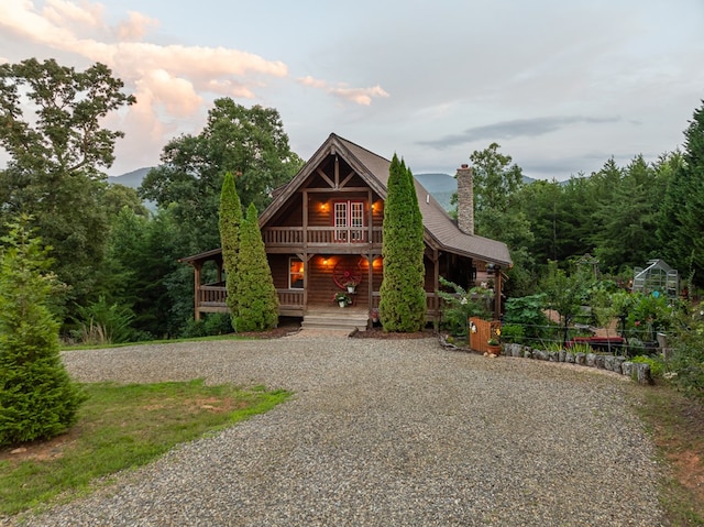 log-style house with a porch