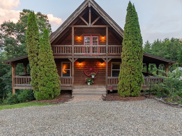 log cabin featuring a porch