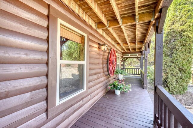 back of house with a wooden deck