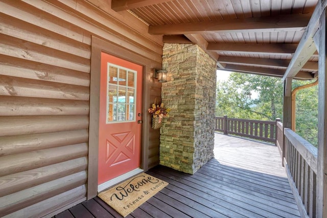 view of exterior entry featuring a deck