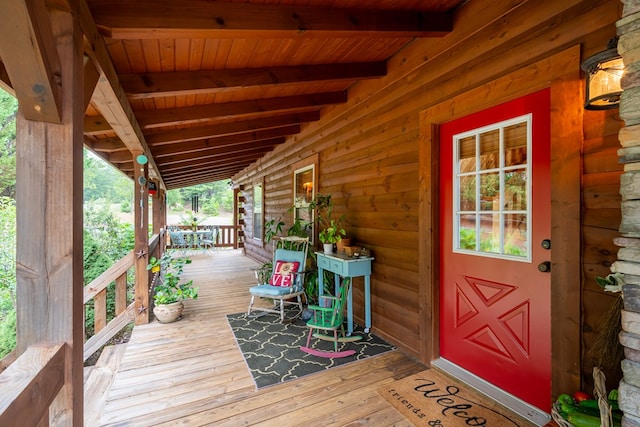 wooden terrace featuring a porch