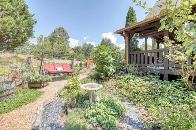 view of yard featuring a wooden deck