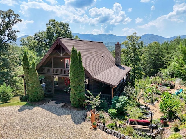 view of front of home featuring a deck with mountain view