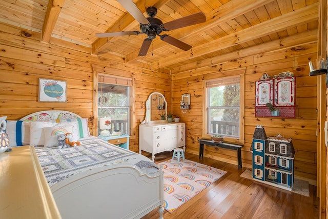 bedroom featuring wood ceiling, hardwood / wood-style floors, and multiple windows