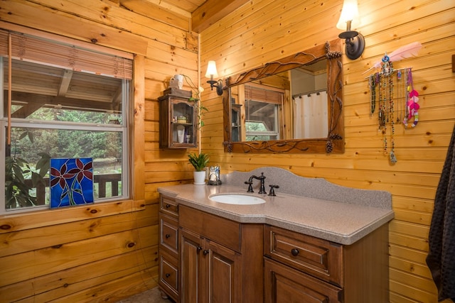 bathroom with wooden walls and vanity