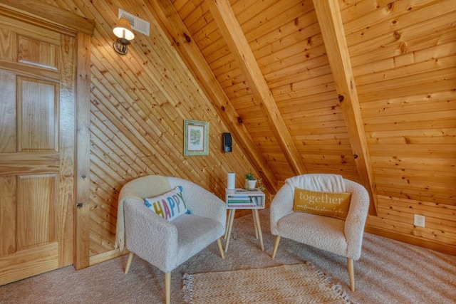 living area featuring wood ceiling, wooden walls, beamed ceiling, and carpet