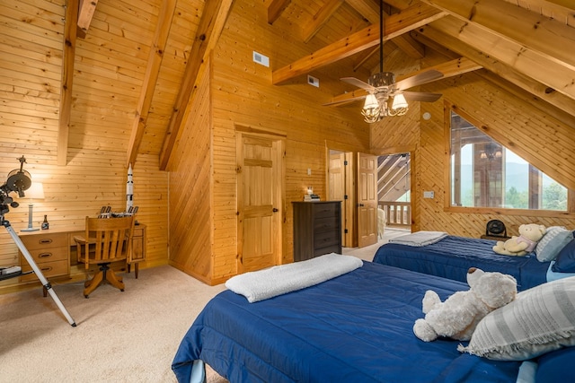 carpeted bedroom with wooden walls, ceiling fan, and beamed ceiling