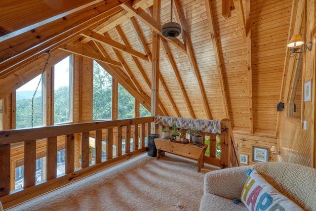 bedroom featuring vaulted ceiling with beams, wooden walls, and carpet flooring