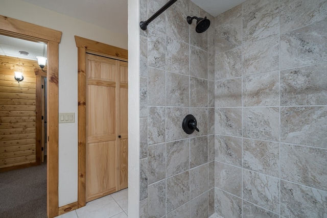 bathroom with a tile shower