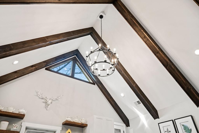 details with beam ceiling and a chandelier