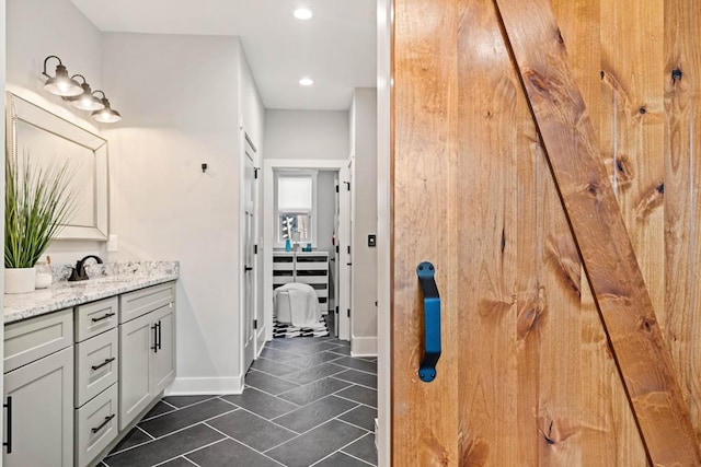 bathroom featuring tile patterned flooring and vanity