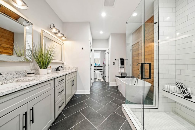 bathroom featuring vanity, separate shower and tub, and tile patterned floors