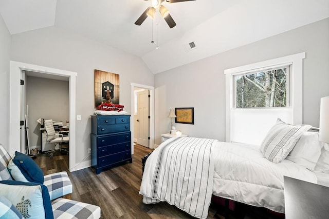 bedroom with dark wood-type flooring, ceiling fan, and vaulted ceiling