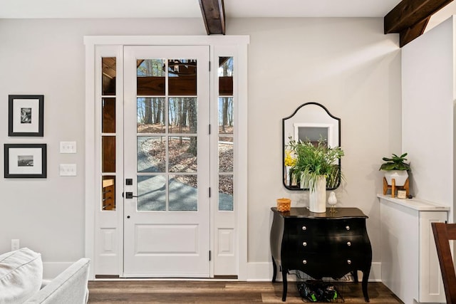 doorway to outside with beamed ceiling and dark hardwood / wood-style floors