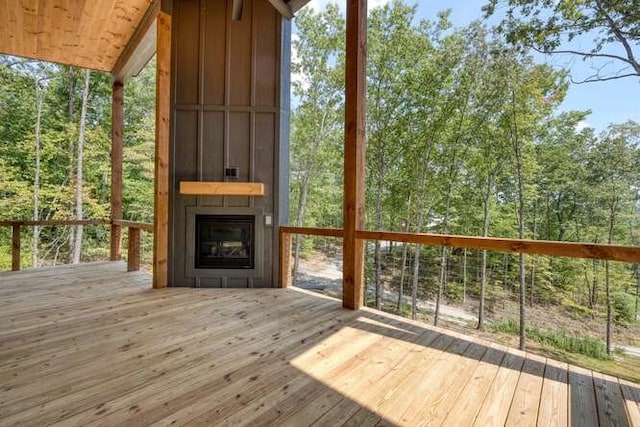 wooden deck featuring a fireplace