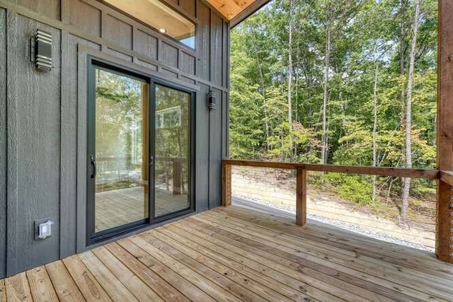 doorway to outside featuring hardwood / wood-style flooring and a healthy amount of sunlight