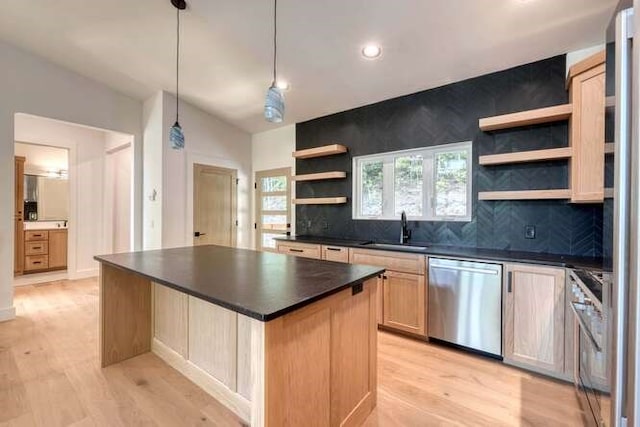 kitchen with stainless steel dishwasher, a center island, sink, and decorative backsplash