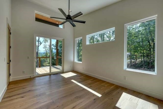 unfurnished room featuring wood-type flooring and ceiling fan