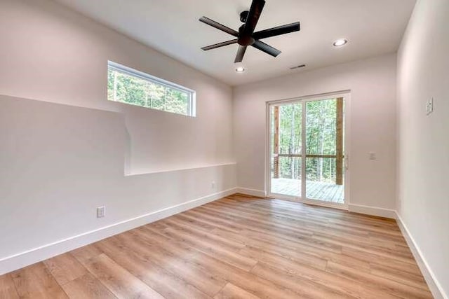 unfurnished room with ceiling fan, a healthy amount of sunlight, and light hardwood / wood-style flooring