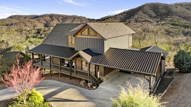 view of front of property featuring covered porch and a mountain view