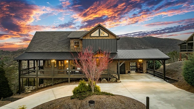 exterior space with a mountain view and a carport