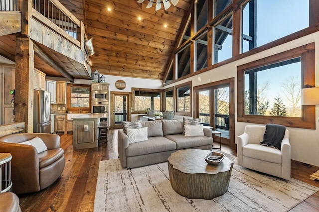 living room featuring wood ceiling, french doors, high vaulted ceiling, hardwood / wood-style flooring, and sink